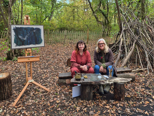 Naomi Joy and presenter Catherine Smith on BBC Countryfile in an autumnal Wiltshire woodland called Green Lane Woods with Naomi's british wildlife art featured Bechstein's bats.